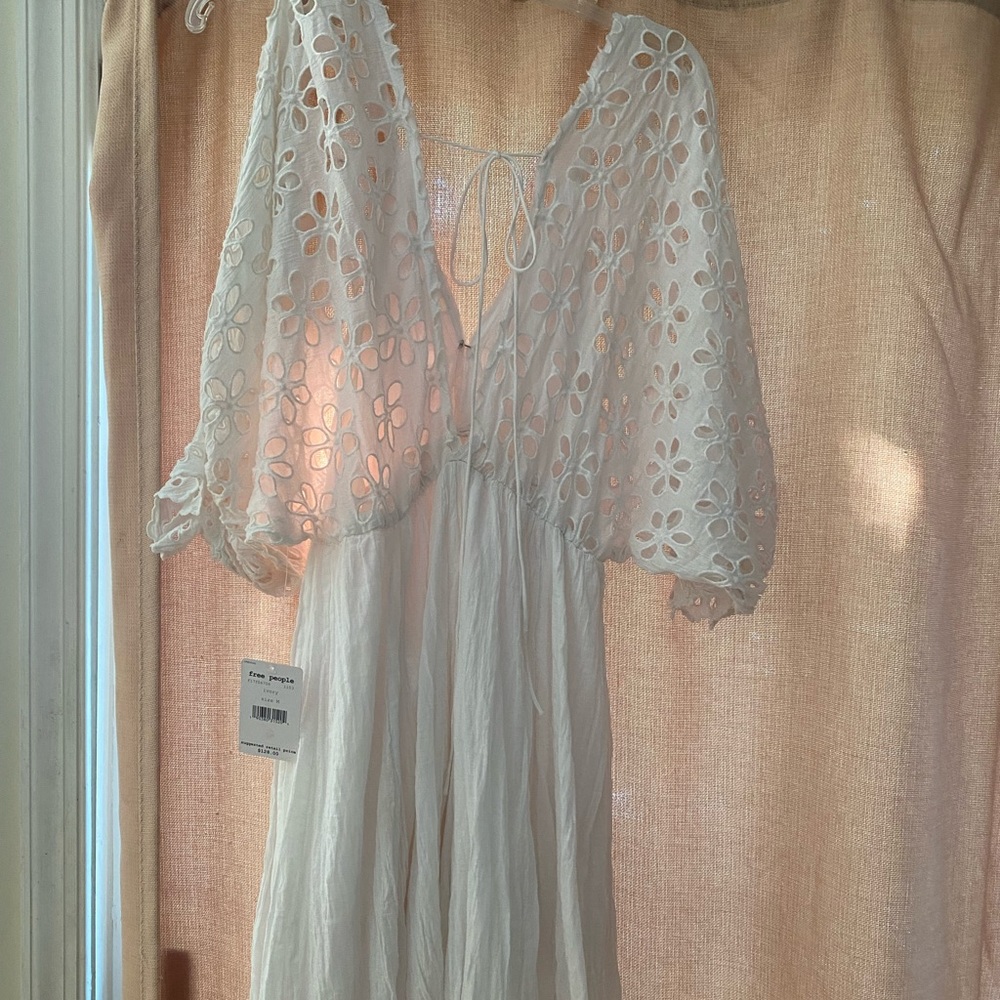 Really cute ivory sun dress - brand new with tag. Free People brand -medium.